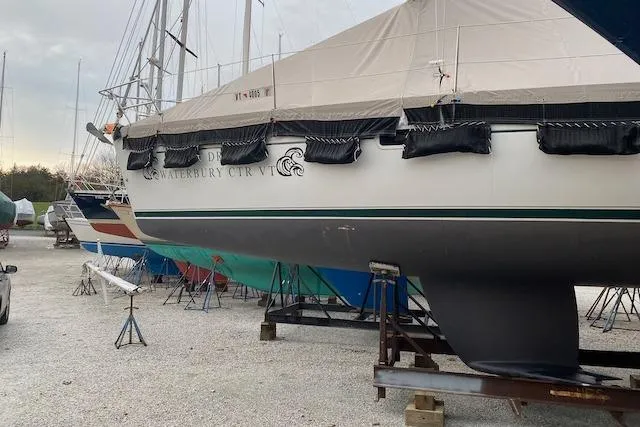 Slide: The Image of 2003 Beneteau Oceanis Clipper 361 sailboat on dry dock, covered and secured. - 36