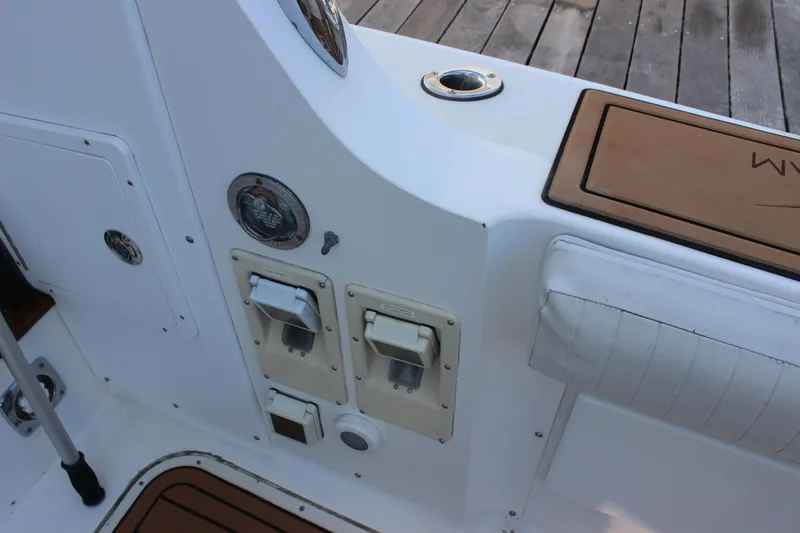 Slide: The Image of 1988 Bertram 33II Flybridge Cruiser cockpit controls and seating area. - 41