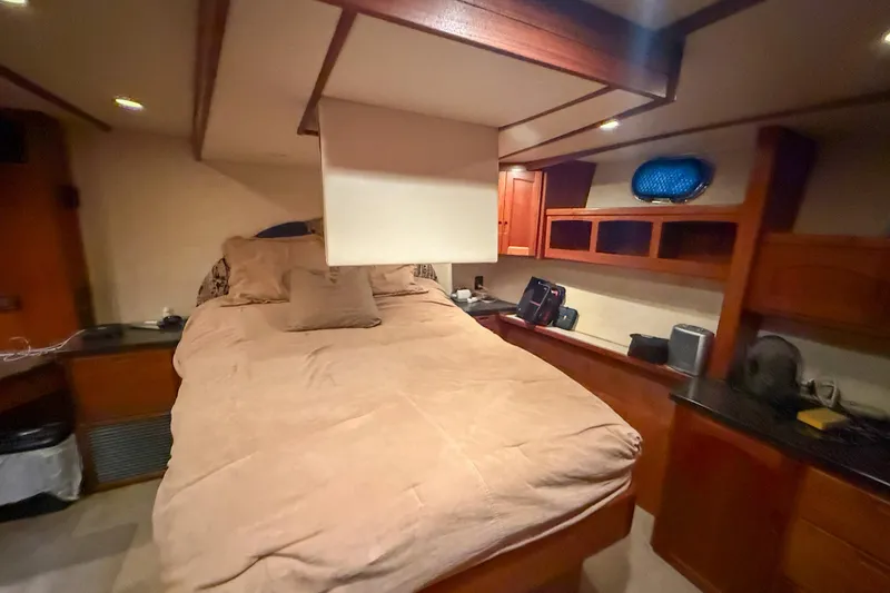 Slide: The Image of 2007 Nordic Tug 54 docked in a covered marina, side view. - 21