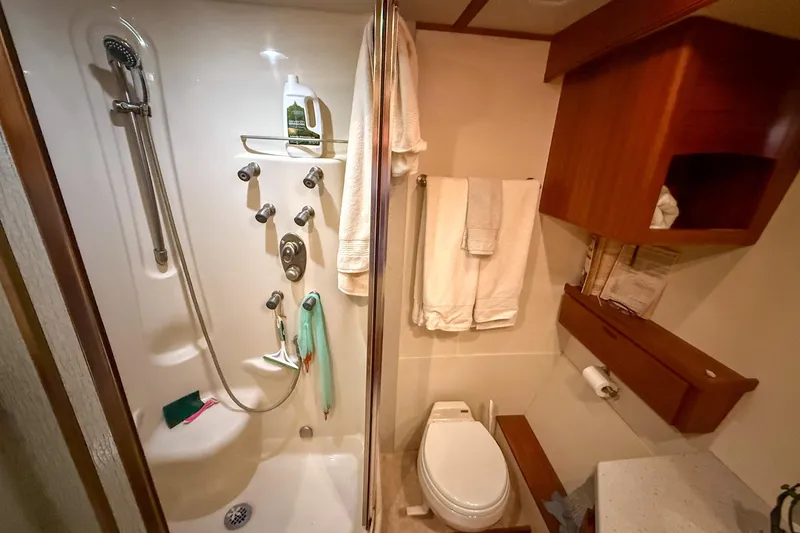 Slide: The Image of Wooden cabinetry and flooring in 2007 Nordic Tug 54 interior, featuring woven baskets and countertop. - 26