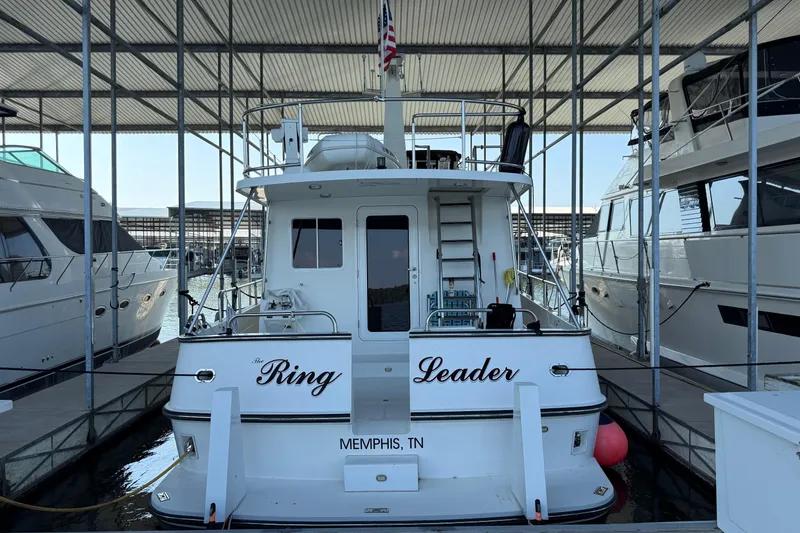 Slide: The Image of 2007 Nordic Tug 54 cruising on a lake under clear blue skies. - 3