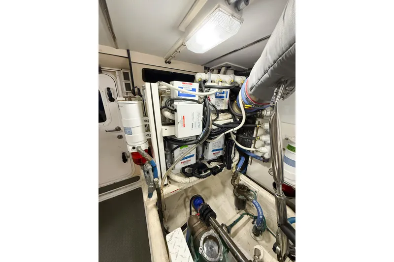 Slide: The Image of Cozy cabin interior of 2007 Nordic Tug 54 with bed and wooden storage. - 34