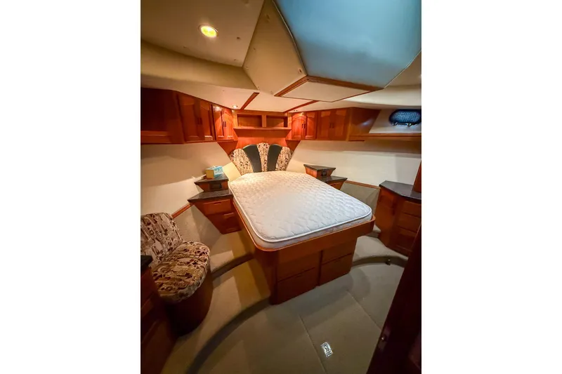 Slide: The Image of Luxurious cabin interior of 2007 Nordic Tug 54 with elegant wood finish. - 54
