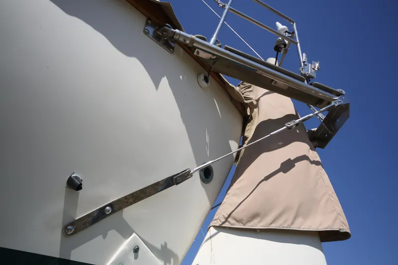 Slide: The Image of 1979 Westsail 32 Shipmaster bow detail against clear blue sky. - 13