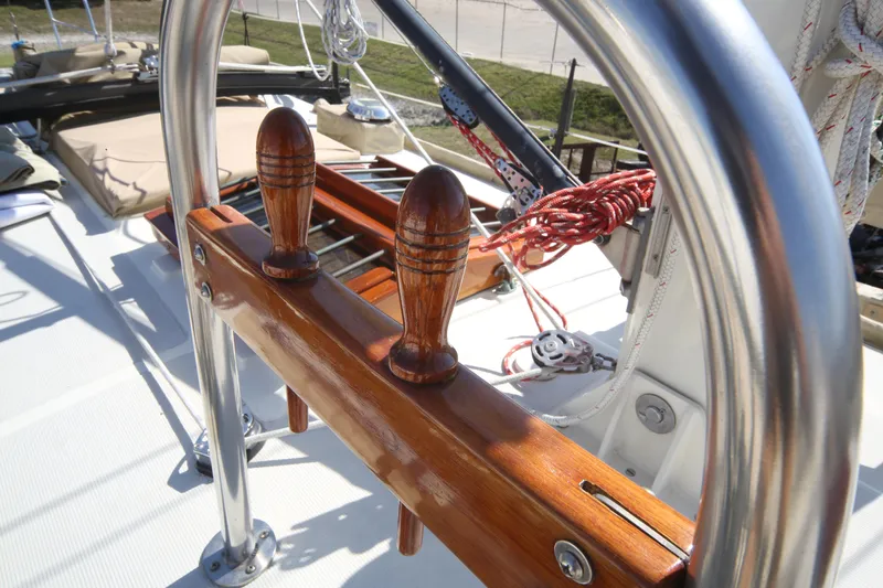 Slide: The Image of 1979 Westsail 32 Shipmaster sailboat deck with polished wood and stainless steel details. - 17