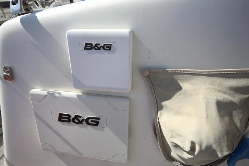 Slide: The Image of B&G equipment on 1979 Westsail 32 Shipmaster, featuring storage pouch and control panel. - 26