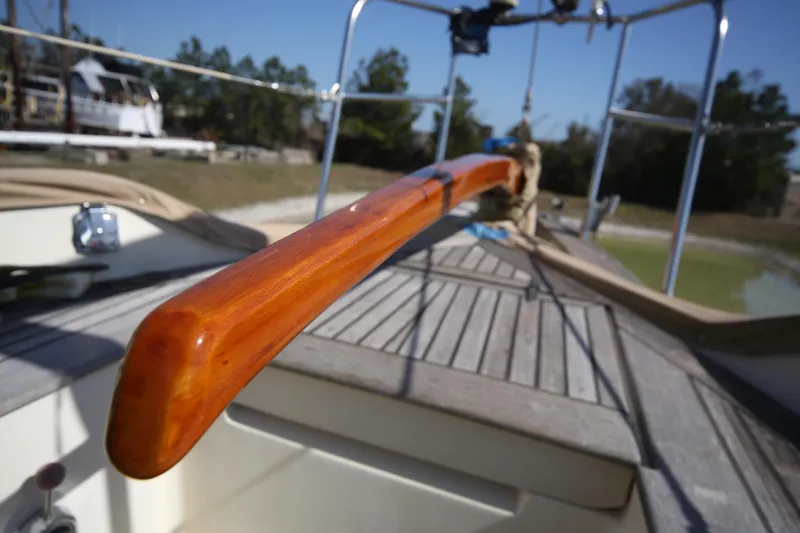 Slide: The Image of 1979 Westsail 32 Shipmaster sailboat with polished wooden tiller and deck. - 27