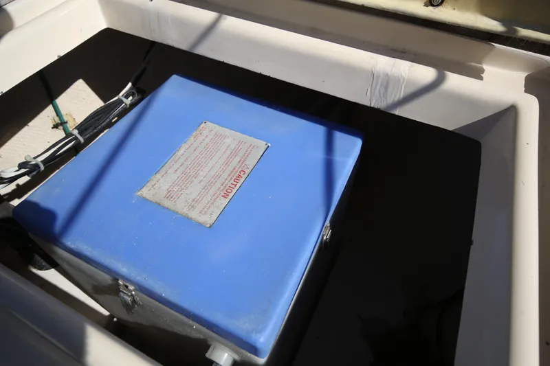 Slide: The Image of Blue battery box in a 1979 Westsail 32 Shipmaster sailboat compartment. - 28