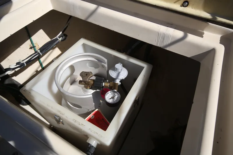Slide: The Image of Propane tank setup in a 1979 Westsail 32 Shipmaster boat compartment. - 29
