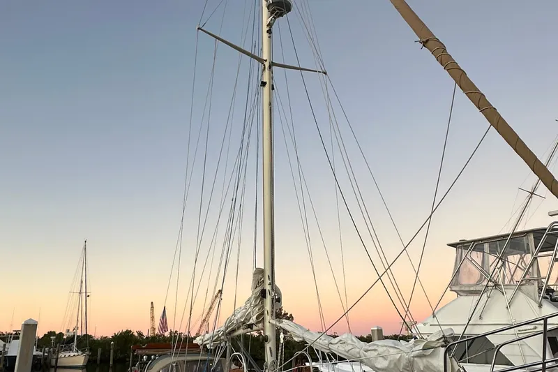 Slide: The Image of Sailboat mast of 1979 Westsail 32 Shipmaster at sunset in marina. - 81