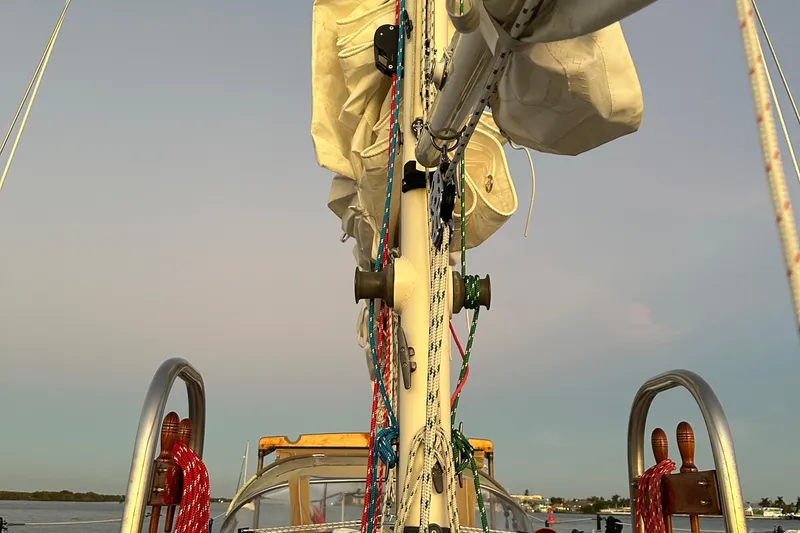 Slide: The Image of Westsail 32 Shipmaster 1979 sailboat mast with rigging and ropes at sunset. - 85