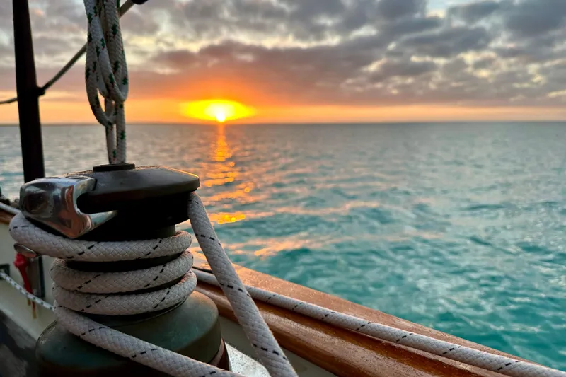 Slide: The Image of Sunset view from 1979 Westsail 32 Shipmaster sailboat, ocean horizon in background. - 88
