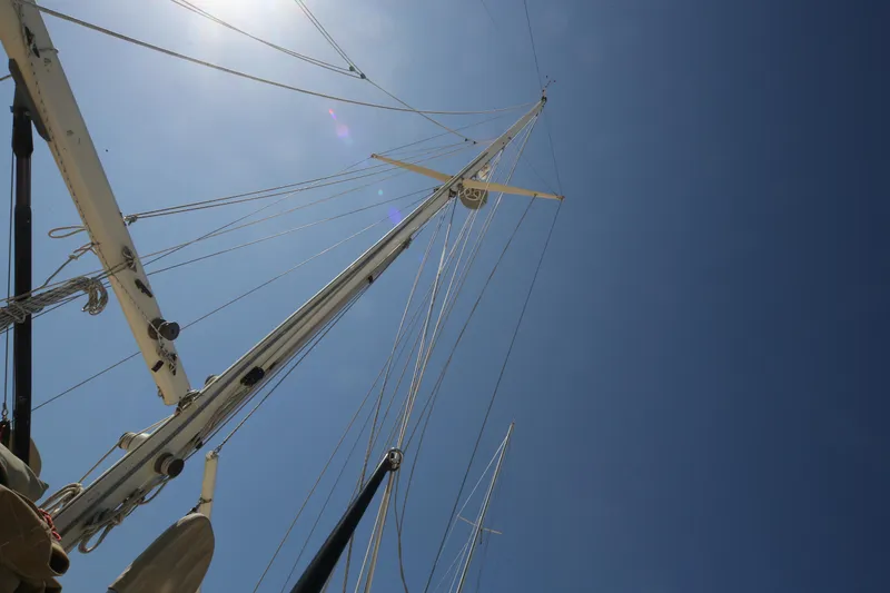 Slide: The Image of Mast and rigging of 1979 Westsail 32 Shipmaster sailboat against clear blue sky. - 9