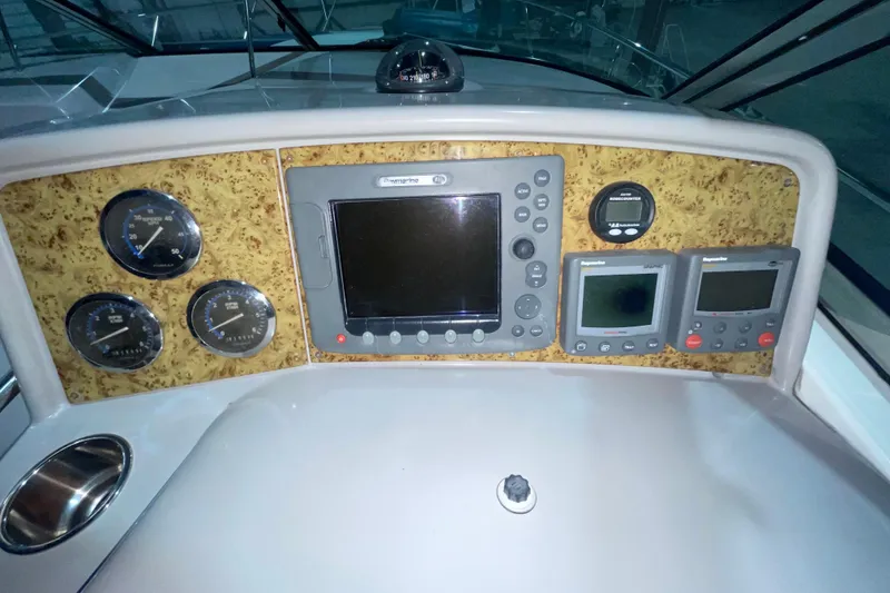 Slide: The Image of 2008 Formula 34 Performance Cruiser dashboard with navigation and control instruments. - 11
