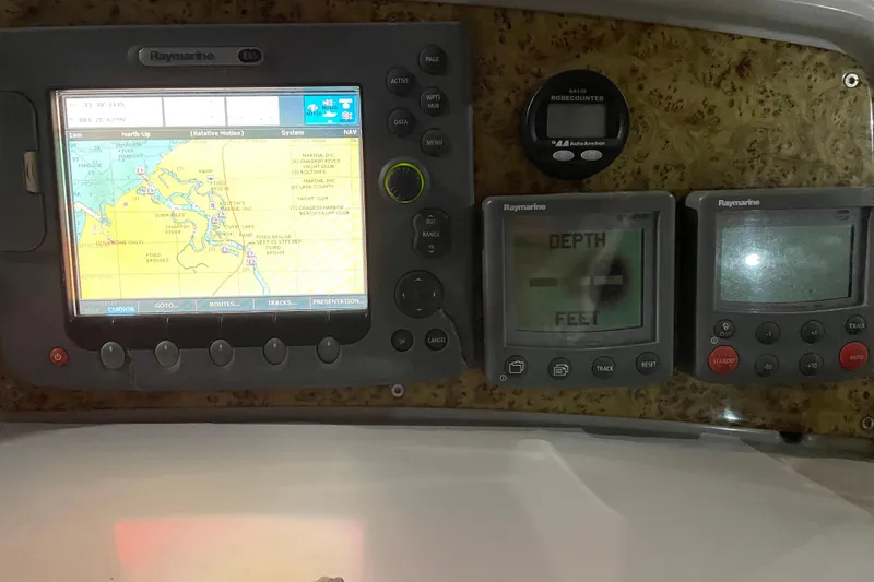 Slide: The Image of Navigation and depth instruments on a 2008 Formula 34 Performance Cruiser. - 13