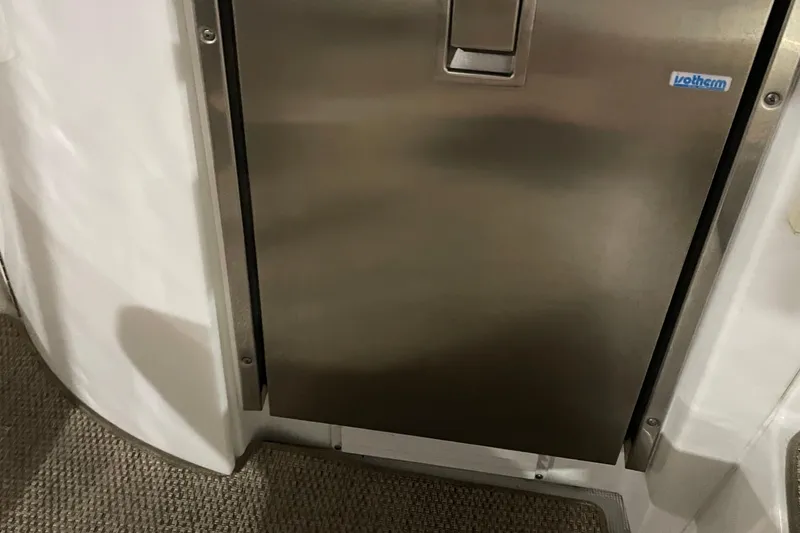 Slide: The Image of Stainless steel door on 2008 Formula 34 Performance Cruiser boat interior. - 18