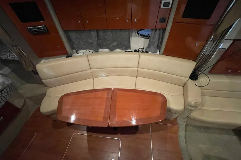 Slide: The Image of 2008 Formula 34 Performance Cruiser interior with beige seating and wooden table. - 20
