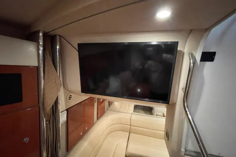 Slide: The Image of Interior of 2008 Formula 34 Performance Cruiser with TV and beige seating. - 23