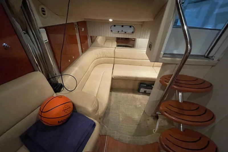 Slide: The Image of Interior of 2008 Formula 34 Performance Cruiser with beige seating and wooden steps. - 24