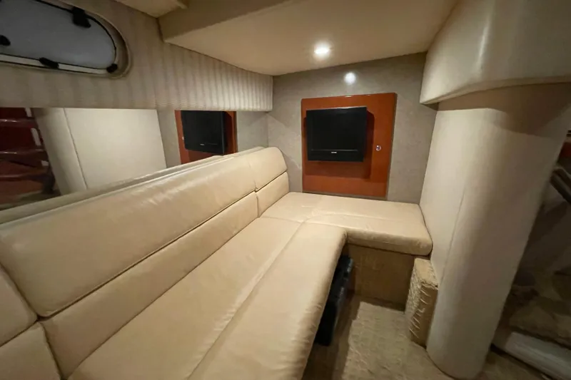 Slide: The Image of Interior of 2008 Formula 34 Performance Cruiser with beige seating and wall-mounted TV. - 25
