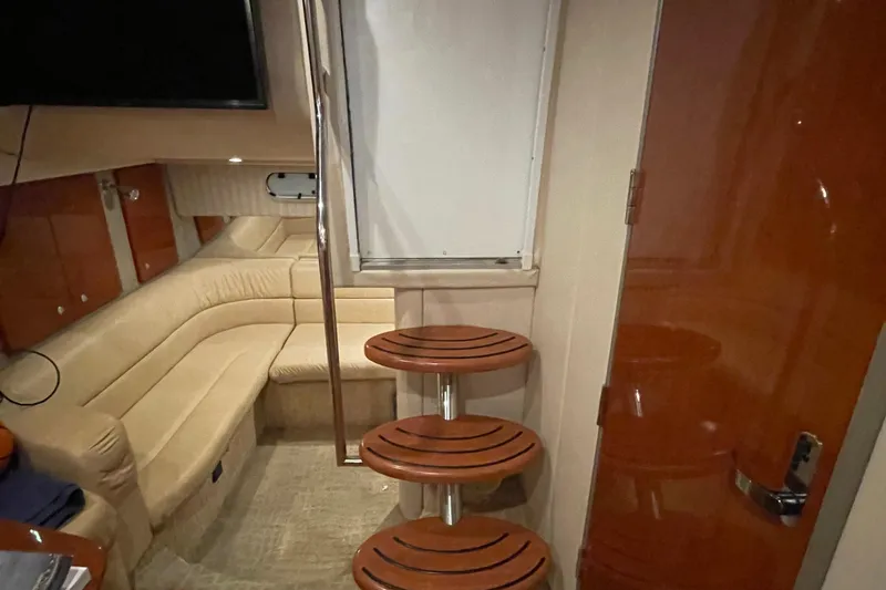 Slide: The Image of Interior of a 2008 Formula 34 Performance Cruiser with beige seating and wooden accents. - 27