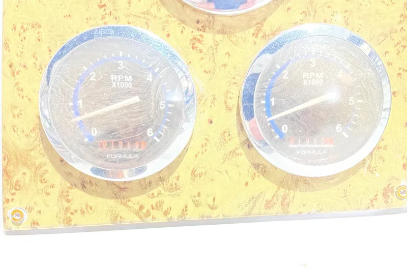 Slide: The Image of Dashboard gauges of a 2008 Formula 34 Performance Cruiser, showing RPM readings. - 31