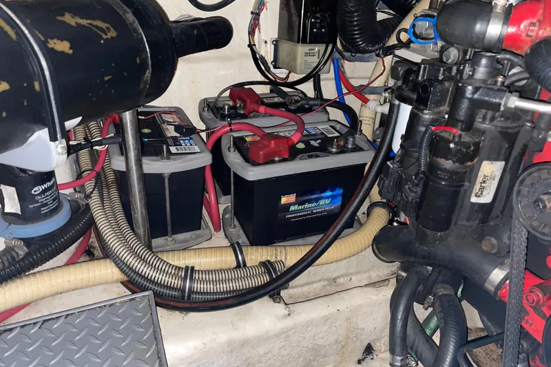 Slide: The Image of 2008 Formula 34 Performance Cruiser engine compartment with marine batteries and wiring. - 34