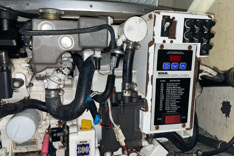 Slide: The Image of Engine compartment of a 2008 Formula 34 Performance Cruiser with Kohler digital control panel. - 35