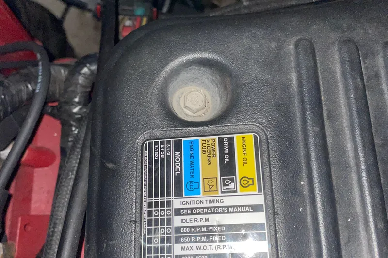 Slide: The Image of Engine cover of 2008 Formula 34 Performance Cruiser with maintenance labels. - 36