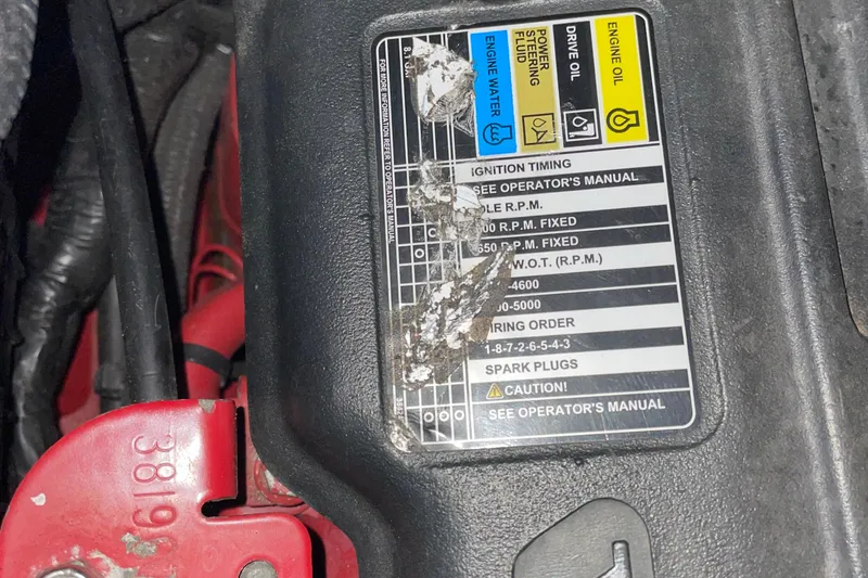 Slide: The Image of 2008 Formula 34 Performance Cruiser engine label with maintenance instructions and color-coded fluid indicators. - 37