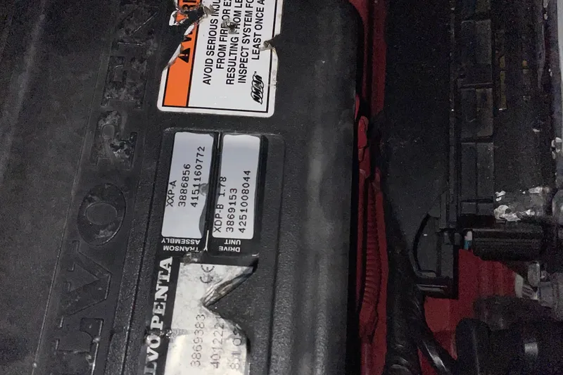 Slide: The Image of Engine compartment of a 2008 Formula 34 Performance Cruiser with visible warning labels. - 39