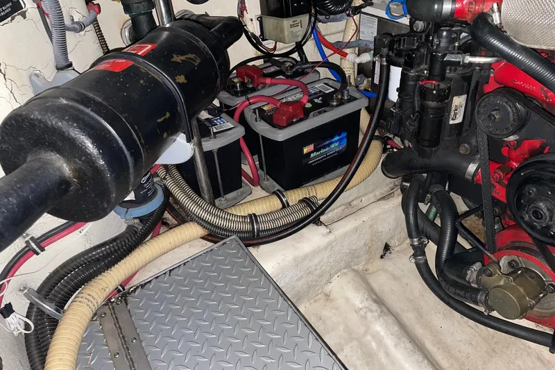 Slide: The Image of Engine compartment of a 2008 Formula 34 Performance Cruiser with visible battery and wiring. - 43