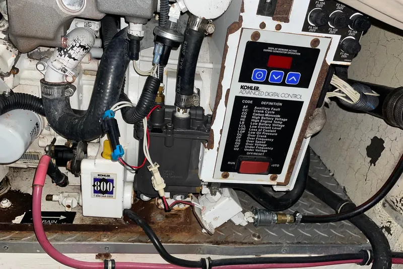 Slide: The Image of Engine compartment of a 2008 Formula 34 Performance Cruiser with Kohler digital control panel. - 47