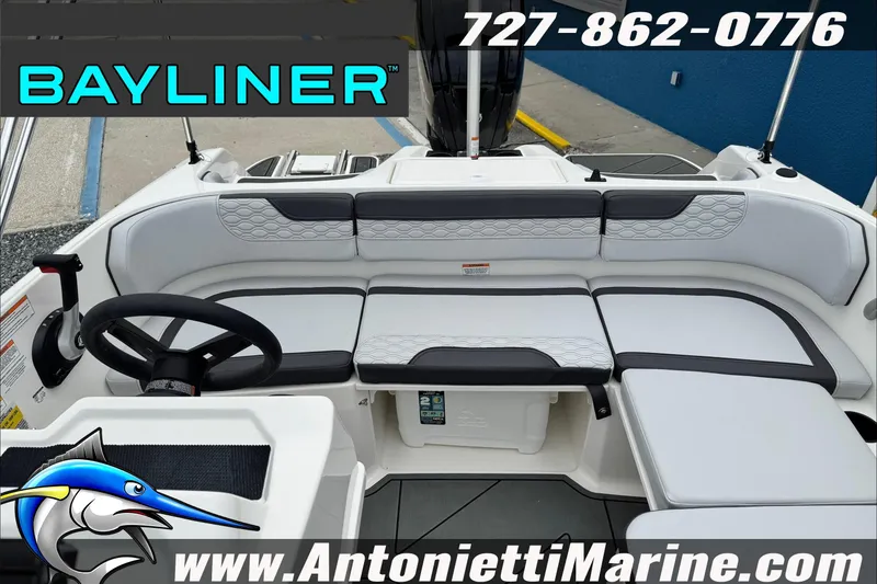 Slide: The Image of 2026 Bayliner Element E17 boat interior with seating, steering wheel, and branding details. - 14
