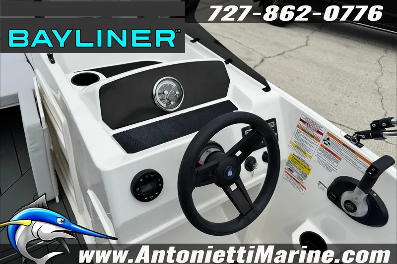 Slide: The Image of 2026 Bayliner Element E17 boat dashboard with steering wheel and controls. - 15