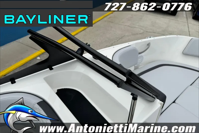 Slide: The Image of 2026 Bayliner Element E17 boat interior with seating, windshield, and branding details. - 22