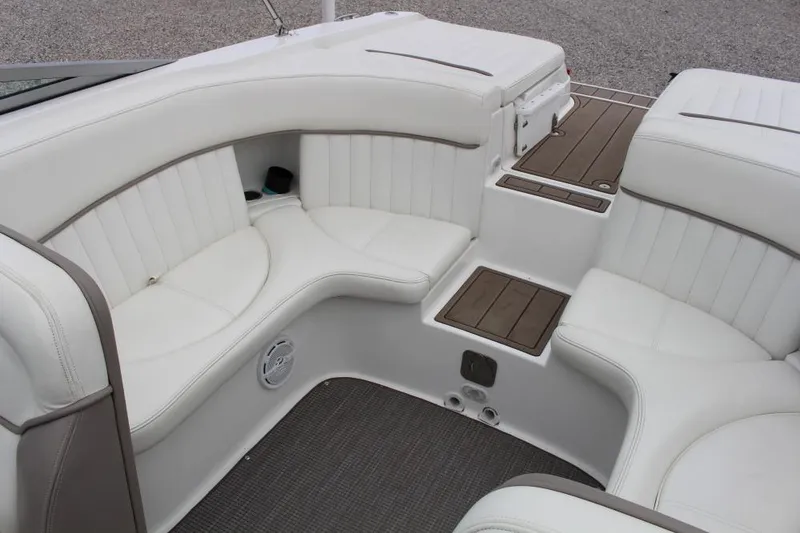 Slide: The Image of 2004 Cobalt 262 boat interior with white leather seating and wood accents. - 10