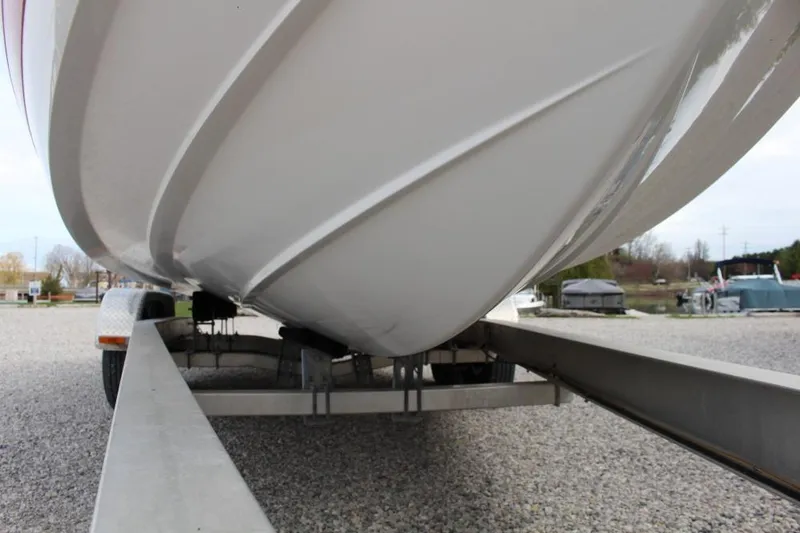 Slide: The Image of 2004 Cobalt 262 boat on trailer, close-up of hull and trailer frame. - 11