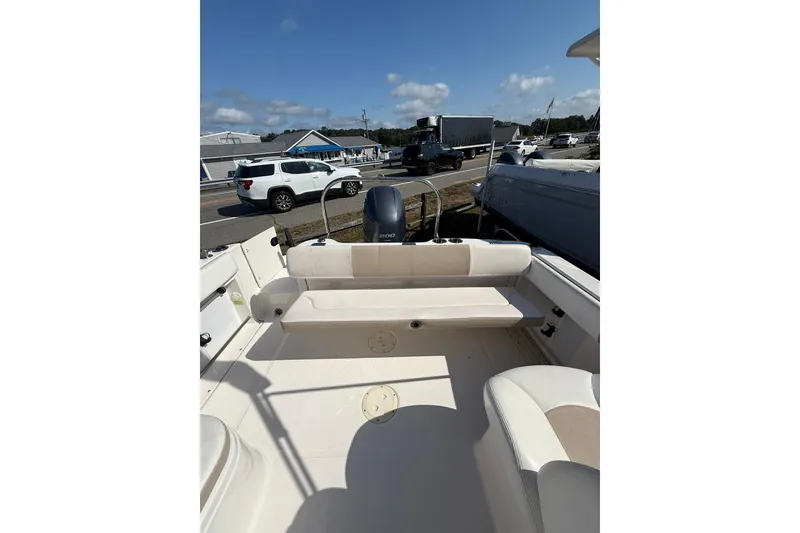 Slide: The Image of 2019 Robalo R227 Dual Console boat interior with seating and outboard motor. - 16