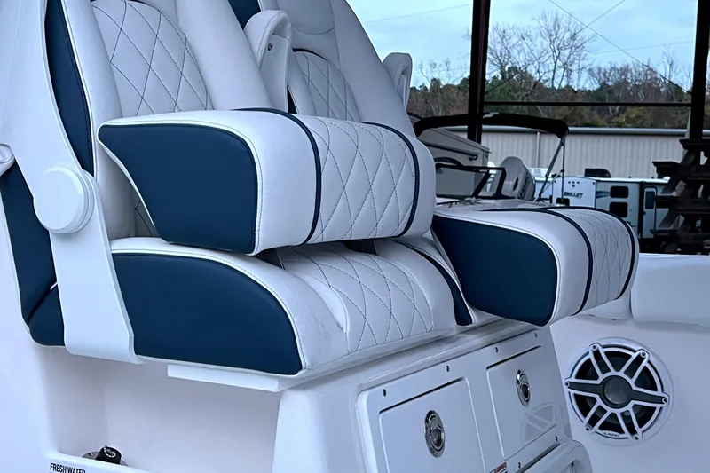 Slide: The Image of Luxury seating on 2025 Sea Fox 288 Commander boat, featuring quilted upholstery and modern design. - 4