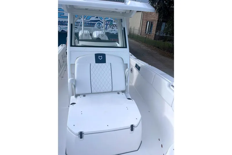 Slide: The Image of 2025 Sea Fox 288 Commander boat interior with white seating and console. - 6