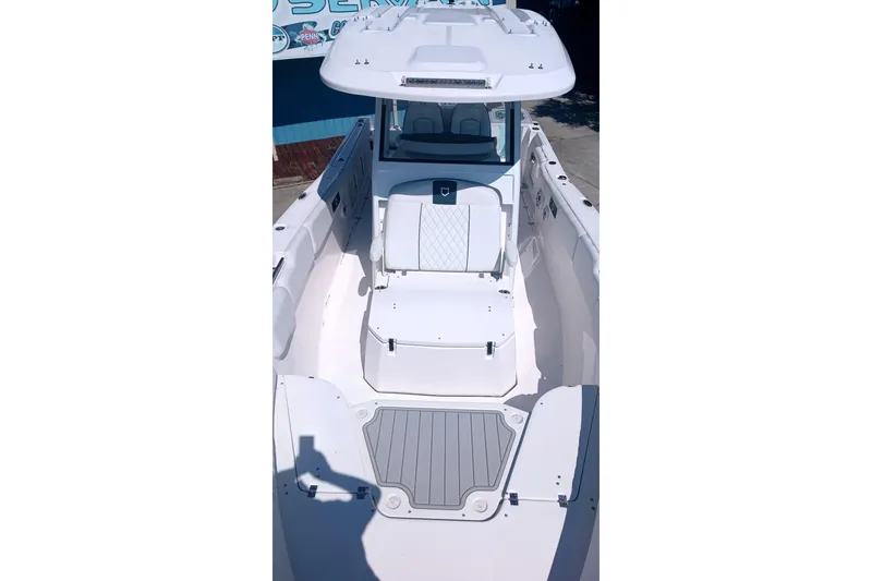 Slide: The Image of 2025 Sea Fox 288 Commander boat interior with seating and deck view. - 9