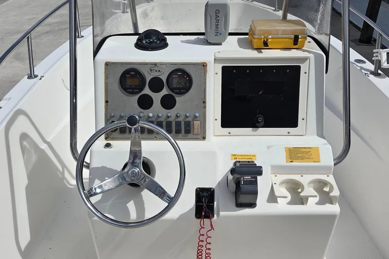 Slide: The Image of Key West 2020 Center Console boat dashboard with steering wheel and controls, 2008 model. - 10