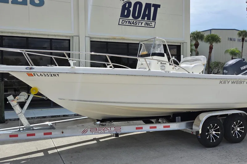 Slide: The Image of Key West 2020 Center Console boat on trailer, parked outside dealership. - 11