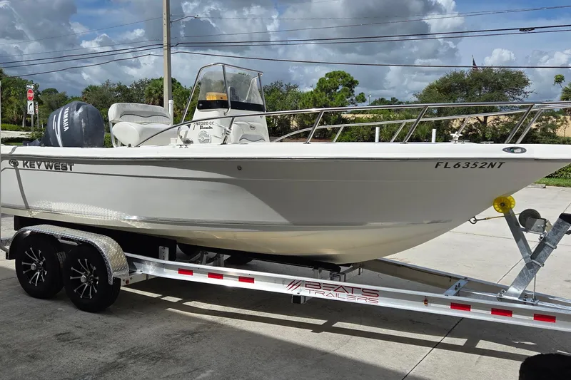 Slide: The Image of Key West 2020 Center Console boat on trailer, 2008 model, parked outdoors. - 2