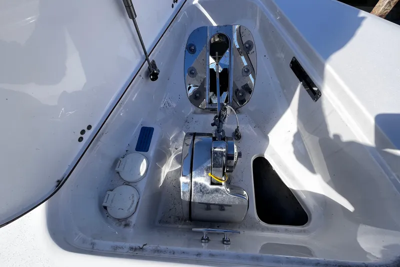 Slide: The Image of 2022 Sea Pro 259 Deep V CC anchor compartment with winch and storage features. - 12