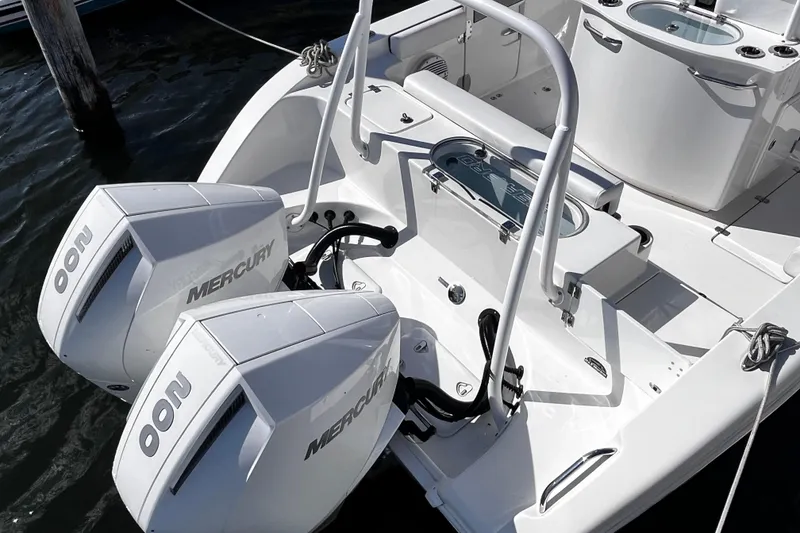 Slide: The Image of 2022 Sea Pro 259 Deep V CC boat with dual Mercury engines docked. - 13