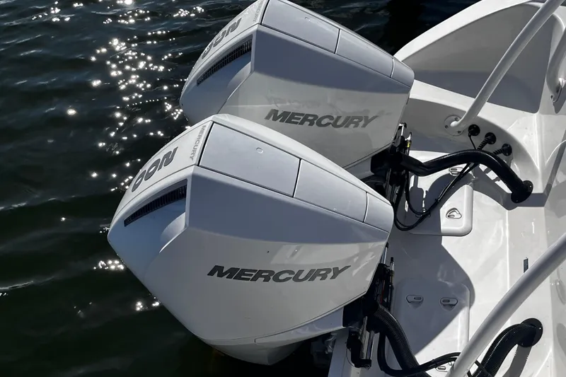 Slide: The Image of Twin Mercury outboard engines on a 2022 Sea Pro 259 Deep V CC boat. - 14