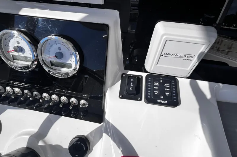 Slide: The Image of Control panel of 2022 Sea Pro 259 Deep V CC boat with gauges and switches. - 7