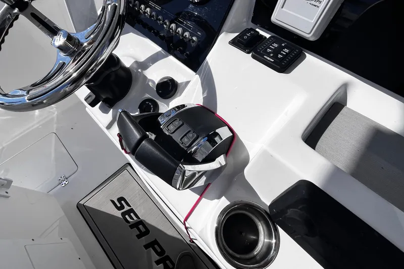 Slide: The Image of 2022 Sea Pro 259 Deep V CC boat console with steering wheel and controls. - 8